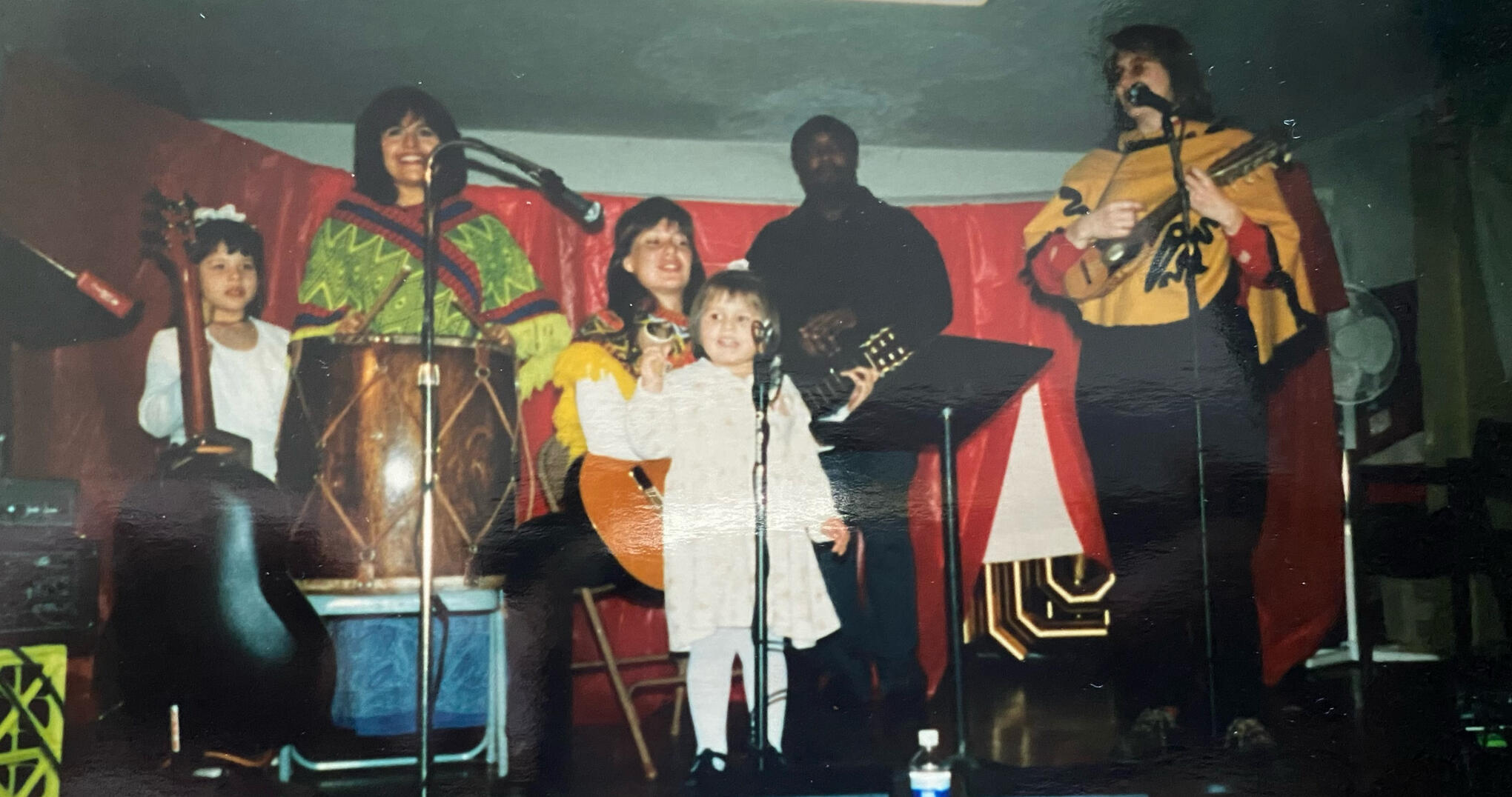 My first performance at the age of 2 with my Mom's Bolivian cover band.